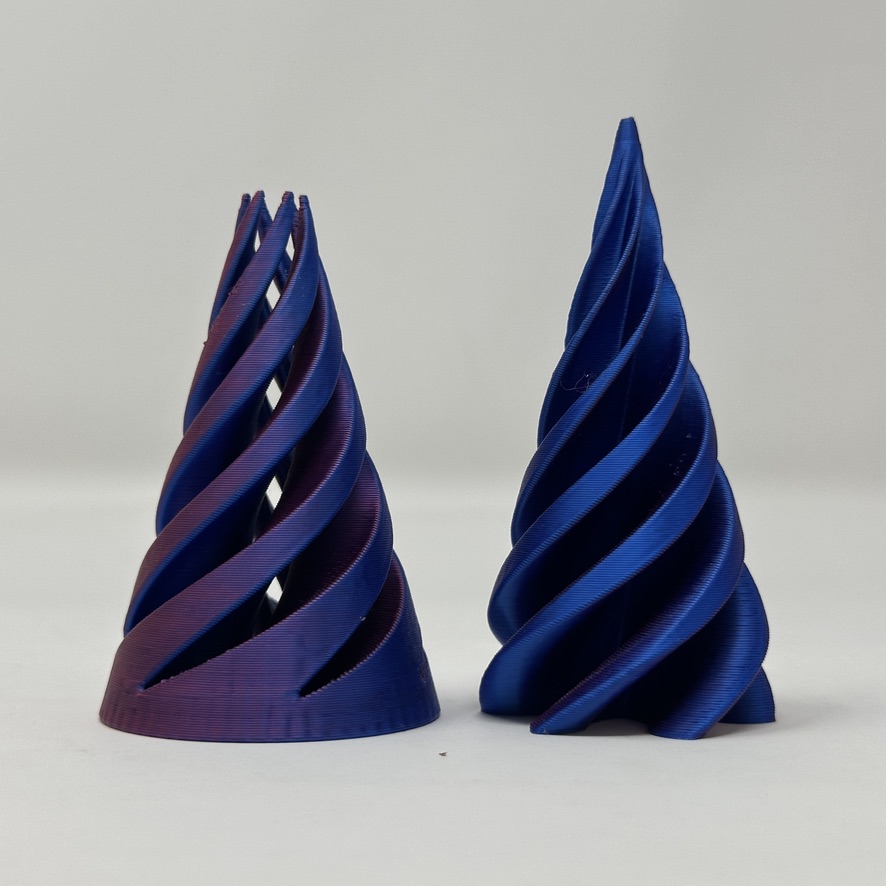 Two blue and violet 3D printed spiral vases